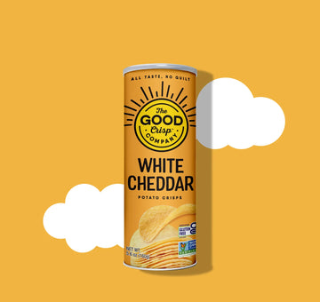 Can of The Good Crisp Company White Cheddar potato crisps on a yellow background
