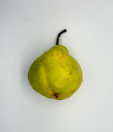 Green pear on a white background