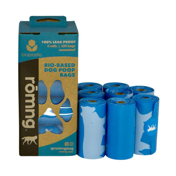 Rolls of blue dog poop bags with packaging on a white background