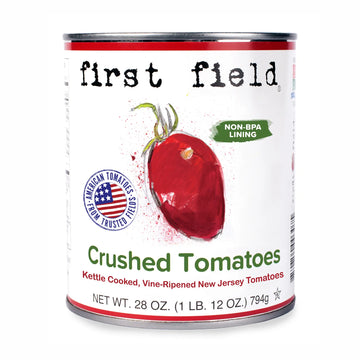 Can of 'first field' crushed tomatoes with tomato illustration and American flag logo.