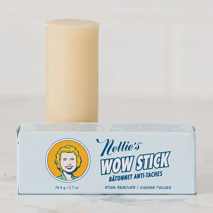 Nellie's Wow Stick packaging with a candle on a light background