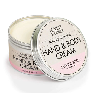 Hand and body cream jar with lid open on a white background