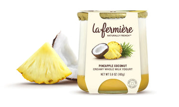 Yogurt container with pineapple and coconut on a white background