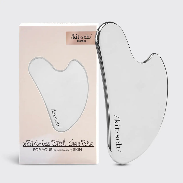 Gua Sha tool with packaging on a white background