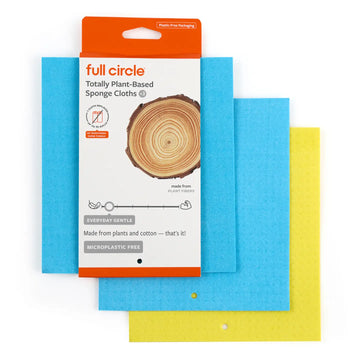 Pack of Full Circle plant-based sponge cloths in blue and yellow, with the orange and white retail packaging visible behind them on a white background.