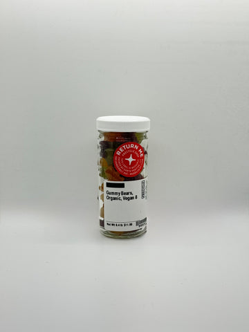 Jar of gummy bears with a label on a gray background